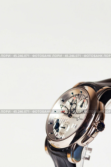 Munich, Swiss - 24 oct 2024: swiss wrist watch Ulysse Nardin SONATA Cathedral, close-up 3d. Silver wristband and bright steel dial, tachymeter, chronograph. Luxury watches concept. Copy ad text space. Редакционное фото, фотограф Aleksandr Golubev / Фотобанк Лори