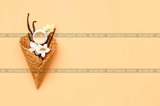 Natural lip balm with vanilla and wafer cone on color background. Стоковое фото, фотограф Pixel_shot / Фотобанк Лори