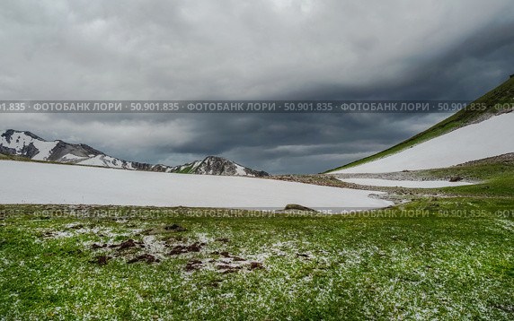Natural rock formation on a green valley and snow riwer. Стоковое фото, фотограф Саблин Станислав / Фотобанк Лори