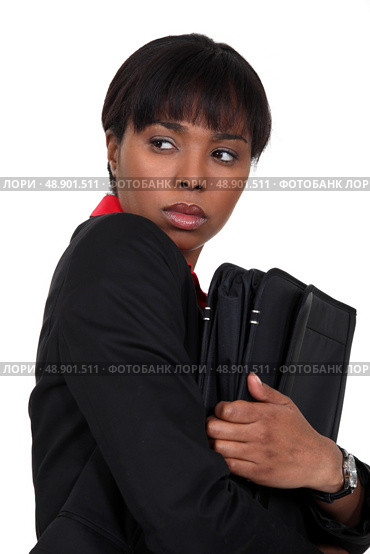 Nervous businesswoman has something to hide. Стоковое фото, агентство Ingram Publishing / Фотобанк Лори