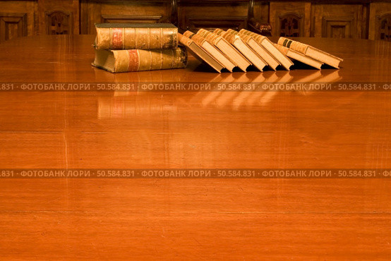 Old books on shining table. Стоковое фото, агентство Ingram Publishing / Фотобанк Лори