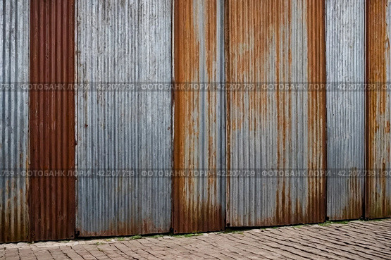 Old industrial corrugated iron industrial texture wall made of tin sheets. Grunge metal plate background. Copy ad text space. Стоковое AI-изображение, AI-художник Aleksandr Golubev / Фотобанк Лори