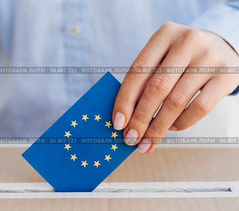 OLYMPUS DIGITAL CAMERA. woman putting european ballot box close up. Стоковое фото, агентство Ingram Publishing / Фотобанк Лори