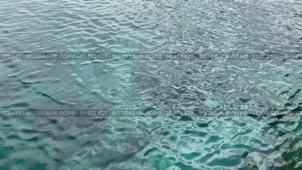 Open Ocean Water with Small Ripples and Sunlight Sparkles. Стоковое видео, видеограф Marina Gabdullina / Фотобанк Лори