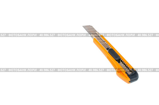 Opened orange paper knife with black handle is layed diagonally on white background. Isolated. Copy space. Раскрытый оранжевый нож для бумаги с черной ручкой расположен по диагонали на белом фоне. Изолированный. Пространство для копирования. Стоковое фото, фотограф Дмитрий Березнев / Фотобанк Лори
