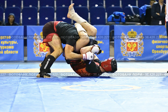 Orenburg, Russia - October 5, 2019: Men compete in Pankration wrestling. Редакционное фото, фотограф Владимир Галкин / Фотобанк Лори