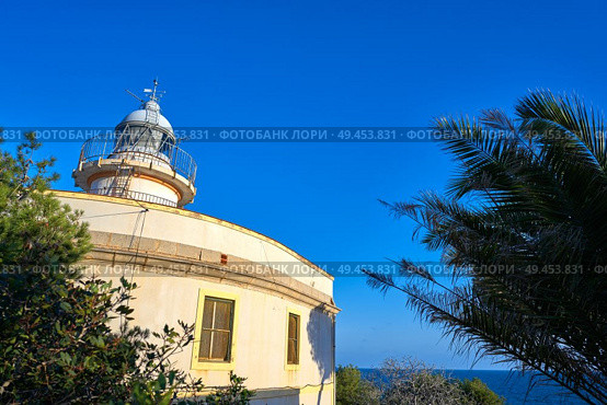 Oropesa de Mar lighthouse Faro in Castellon of Spain. Стоковое фото, агентство Ingram Publishing / Фотобанк Лори
