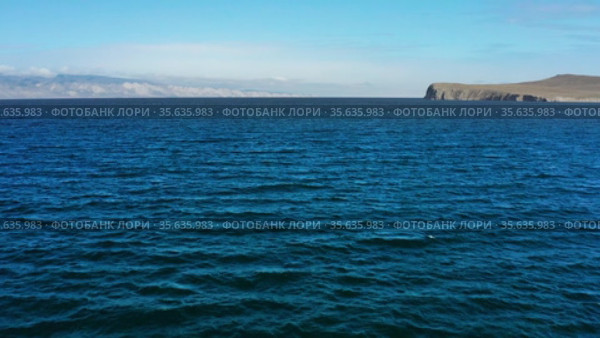 Озеро Байкал осенью. Пролив Малое море. Вид с воздуха. Lake Baikal in autumn. Small Sea strait. Aerial view. Стоковое видео, видеограф Евгений Романов / Фотобанк Лори