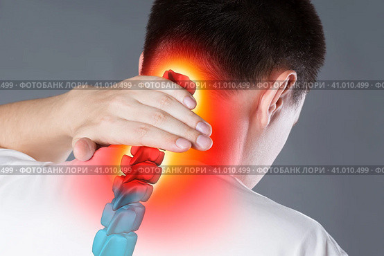 Pain in the spine, a man with backache, injury in the human neck, chiropractic treatments concept. Стоковое фото, фотограф Станислав Тарко / Фотобанк Лори