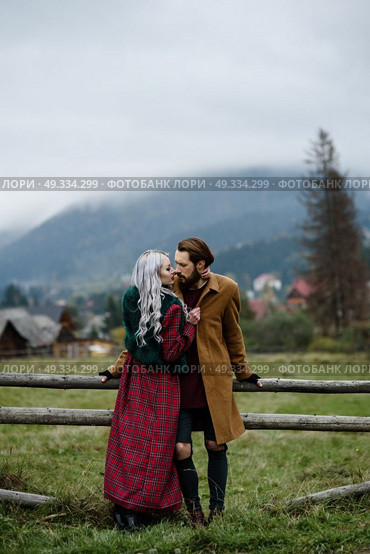 pair of lovers in the Carpathian mountains in national costumes. Стоковое фото, агентство Ingram Publishing / Фотобанк Лори