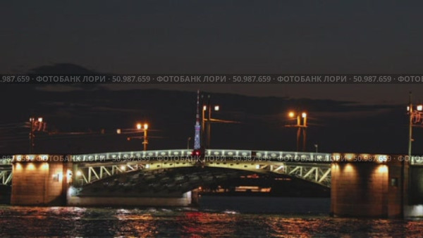 Palace Bridge in St. Petersburg at night. Neva river and Palace (Dvortsovy) Bridge - symbol of St. Petersburg Russia. High quality footage for travel agencies, guides and tour operators. Стоковое видео, видеограф Ирина Михайличенко / Фотобанк Лори