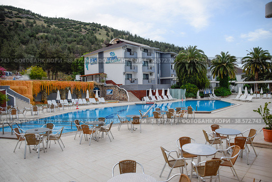 Pam Hotel, view from the courtyard. Pool and restaurant tables. Thermal balneotherapy, hotel (2019 год). Редакционное фото, фотограф Леонид Еремейчук / Фотобанк Лори