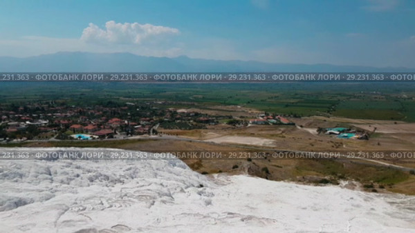 Panorama view from above on Pamukkale . Aerial view of Hierapolis Ancient Greco-Roman city in Turkey. Стоковое видео, видеограф Сергей Тимофеев / Фотобанк Лори