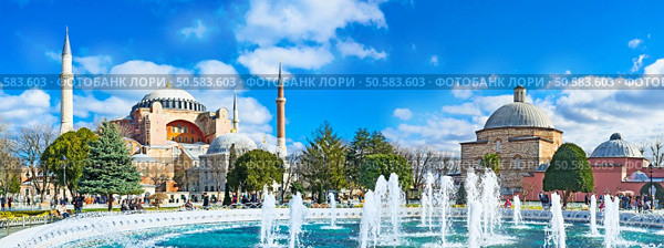 Panoramic view of the Hagia Sophia and Ayasofya Hurrem Sultan Hamam from the Sultanahmet park, Istanbul, Turkey. Стоковое фото, агентство Ingram Publishing / Фотобанк Лори