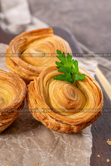 Pastries filled with meat, traditionally baked in black clay molds both from the region on Vila Real, Portugal. Стоковое фото, агентство Ingram Publishing / Фотобанк Лори