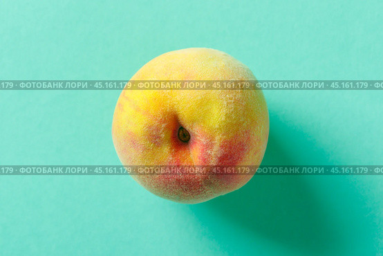 peach on a blue wooden background. Стоковое фото, фотограф Сергей Толмачёв / Фотобанк Лори