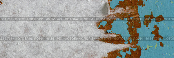 Peeling paint on the wall. Panorama of a concrete wall with old cracked flaking paint. Weathered rough painted surface with patterns of cracks and peeling. Wide panoramic grungy texture for background. Стоковое фото, фотограф Андрей Степанов / Фотобанк Лори