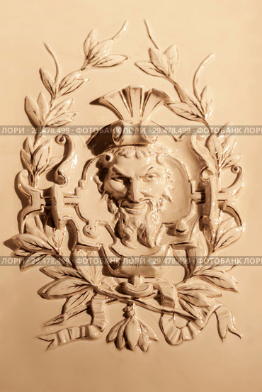 Perm, Russia - November 24, 2018: tiled panel with a bas-relief on an old fireplace of the XIX century. Редакционное фото, фотограф Евгений Харитонов / Фотобанк Лори