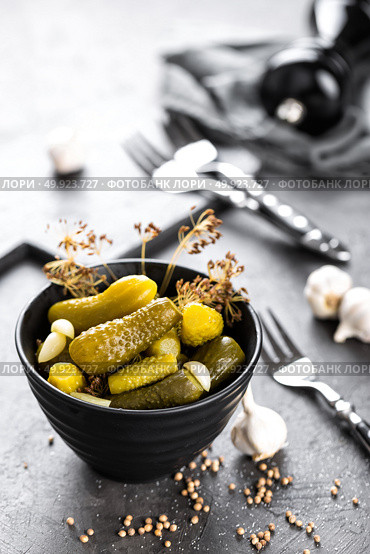 Pickled cucumbers, small marinated pickles, gherkins. Стоковое фото, агентство Ingram Publishing / Фотобанк Лори