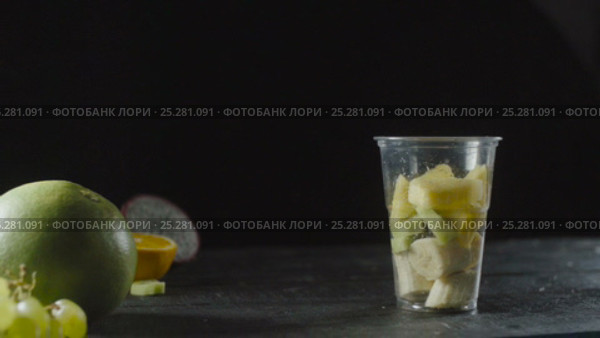 Pineapple Slices Add a Fruit Cocktail Cup. Стоковое видео, видеограф Станислав Панкратов / Фотобанк Лори