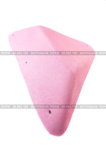 Pink climbing hold with textured surface and angular shape for indoor bouldering or rock climbing gym, isolated on white background. Стоковое фото, фотограф Татьяна Терехина / Фотобанк Лори