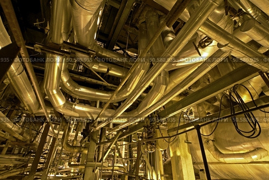Pipes, tubes, machinery and steam turbine at a power plant        . Стоковое фото, агентство Ingram Publishing / Фотобанк Лори