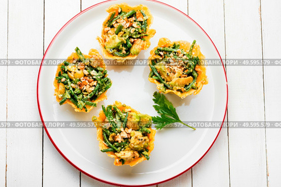 Plate with cheese basket with avocado,cowpea and nuts.Banquet,holiday food. Cheese basket stuffed with vegetables. Стоковое фото, агентство Ingram Publishing / Фотобанк Лори
