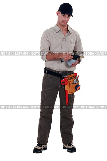 Plumber with blowtorch, studio shot. Стоковое фото, агентство Ingram Publishing / Фотобанк Лори