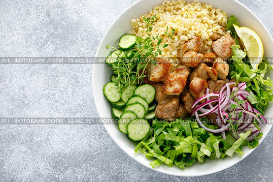 Pork kebab bulgur salad bowl with cucumber, lettuce, thyme and mustard sauce. Стоковое фото, агентство Ingram Publishing / Фотобанк Лори