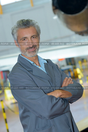 portrait of aerospace engineer posing. Стоковое фото, агентство Ingram Publishing / Фотобанк Лори