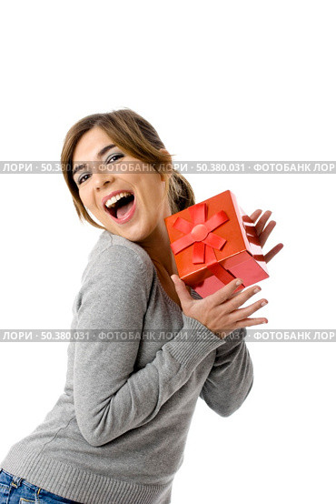 Portrait of an happy young woman holding a gift - isolated on white background. Стоковое фото, агентство Ingram Publishing / Фотобанк Лори
