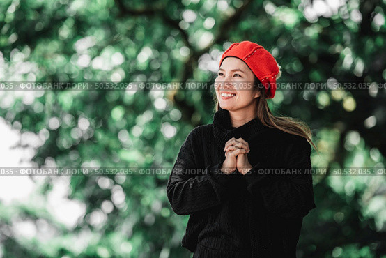Portrait of Asian young woman in winter costume praying in the morning at the woodland. Christianity and faith hope love concept. Стоковое фото, агентство Ingram Publishing / Фотобанк Лори