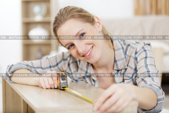portrait of happy female woodworker drafting new project at workshop. Стоковое фото, агентство Ingram Publishing / Фотобанк Лори