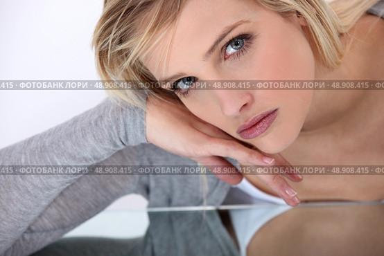 portrait of young pretty blonde looking serious. Стоковое фото, агентство Ingram Publishing / Фотобанк Лори