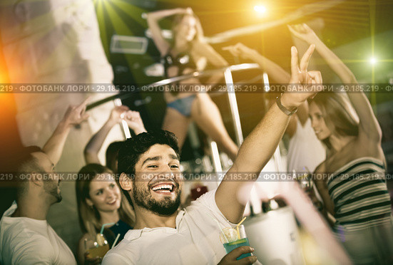 positive male joying and thumbs up on party in the club with coc. Стоковое фото, фотограф Яков Филимонов / Фотобанк Лори