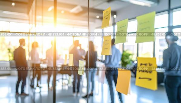 Post-it notes on a glass wall with blurred team in background depicting modern brainstorming sessions, team collaboration, and agile work environments. Стоковое AI-изображение, AI-художник Ольга Сухарева / Фотобанк Лори