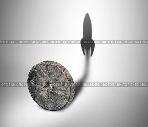 Potential of technology and to accelerate invention and the evolution of tech as a stone wheel casting a shadow of an advanced rocket blasting off to forge ahead into the future in a 3D illustration style. Стоковое фото, агентство Ingram Publishing / Фотобанк Лори