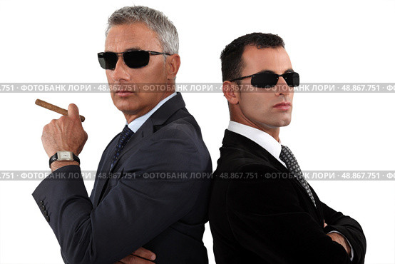Powerful businessmen in sunglasses. Стоковое фото, агентство Ingram Publishing / Фотобанк Лори
