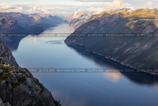 Preikestolen or Prekestolen or Preacher's Pulpit or Pulpit Rock, is a famous tourist attraction in Forsand, Ryfylke, Norway (2017 год). Стоковое фото, фотограф Алексей Ширманов / Фотобанк Лори