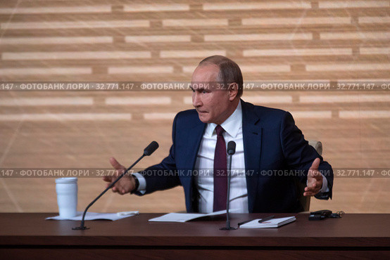 Президент Российской Федерации Владимир Владимирович Путин говорит во время большой ежегодной пресс-конференции в Центре международной торговли на Красной Пресне в центре города Москвы, Россия 19 декабря 2019. Редакционное фото, фотограф Николай Винокуров / Фотобанк Лори