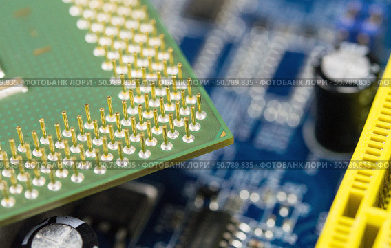 Процессор на материнской плате. Central Processing Unit CPU on the motherboard. Стоковое фото, фотограф Татьяна Д / Фотобанк Лори