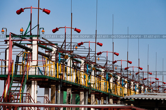 Railway filling station or terminal on oil refinery plant. Anti-fire system. Close up. Blue sky background. Kazakhstan, Taraz city. Стоковое фото, фотограф Alexey Rezvykh / Фотобанк Лори