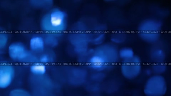 Расфокусированное движение частиц в голубой воде. абстракция. Стоковое видео, видеограф Александр Собко / Фотобанк Лори