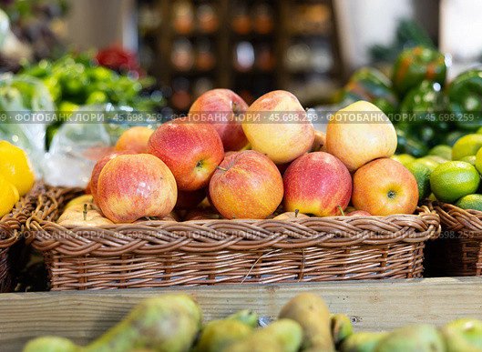 Red apple fruits are stacked in large and capacious boxes. Стоковое фото, фотограф Яков Филимонов / Фотобанк Лори