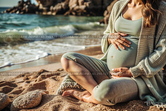 Relaxation, peace of mind, sea air. Close-up of the tummy. A pregnant woman on the beach by the sea. The concept of pregnancy, childbirth and parental responsibilities. Стоковое AI-изображение, AI-художник Photojuli / Фотобанк Лори