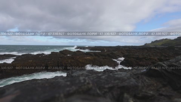 Rocky coast of the Barents Sea, waves and surf on the coast of the Rybachy Peninsula, Kola Peninsula, Cape Kekursky. High quality 4k footage. Стоковое видео, видеограф Евгения Глинская / Фотобанк Лори