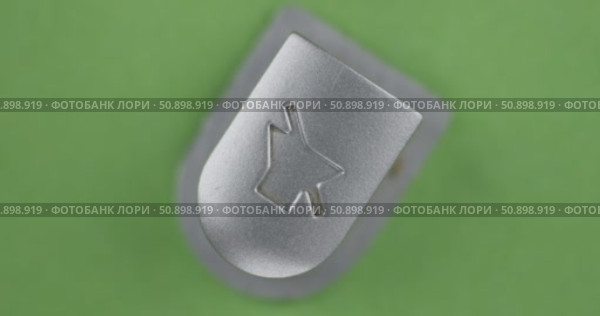Rotation, button with the MUTE SOUND symbol. Crossed speaker icon. Top view. Isolated on green background. Стоковое видео, видеограф Александр Собко / Фотобанк Лори