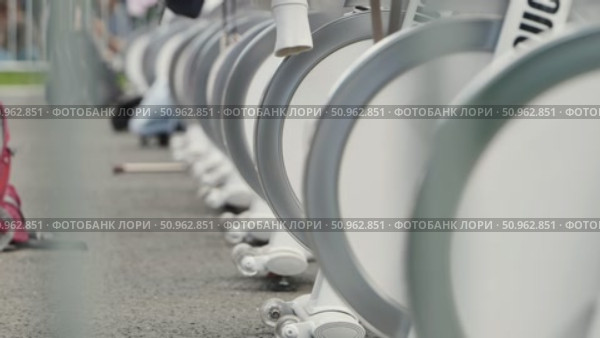 Row of Stationary Bikes Ready for Exercise. Стоковое видео, видеограф Mikhail Davidovich / Фотобанк Лори