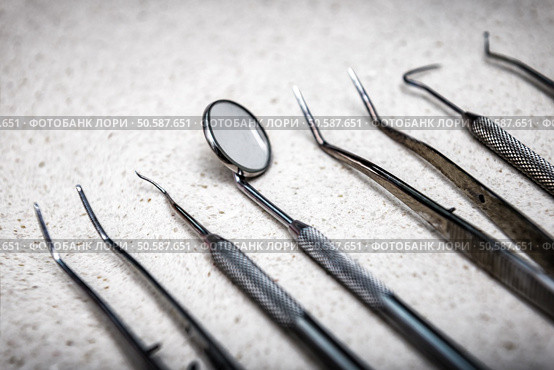 Row of various dental tools (instruments). various dental instruments. Стоковое фото, агентство Ingram Publishing / Фотобанк Лори