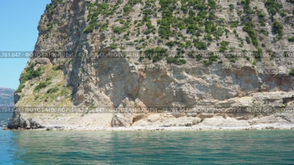 RT Dubovica Rocks near Buljarica and Svetac Rock, Montenegro. Stones, inaccessible rocks. Flysch marine lithological layers. Adriatic Mediterranean sea blue water. Nature park Katici. District Budva. Стоковое видео, видеограф Юлия Петровская / Фотобанк Лори